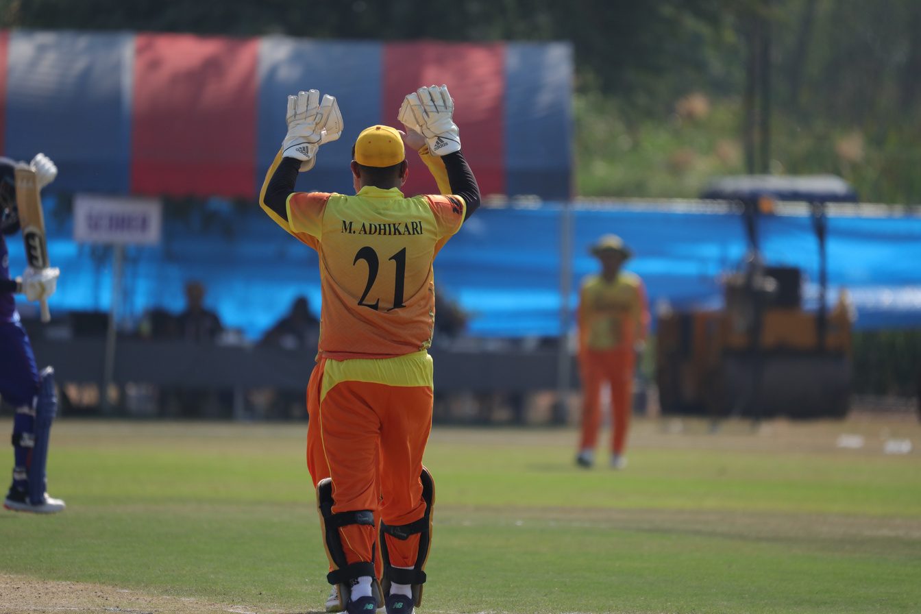 Behind the stumps for Bhutan — number 21.