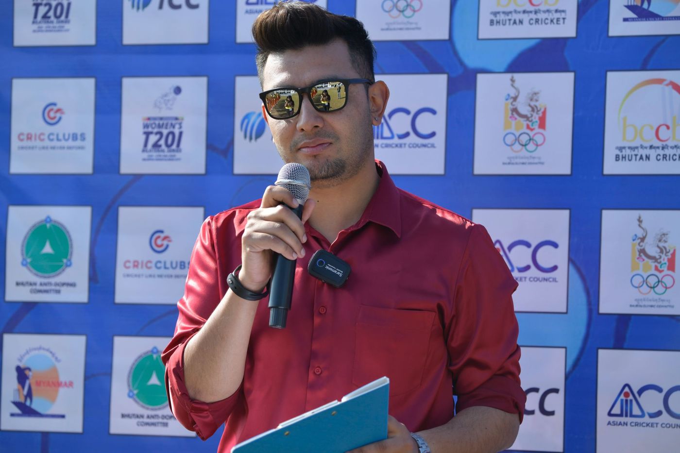 On the mic at a Women's T20I series